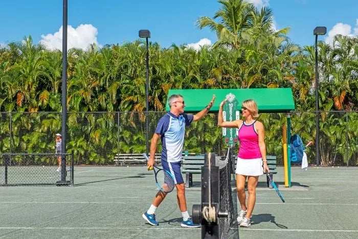 2 people playing tennis